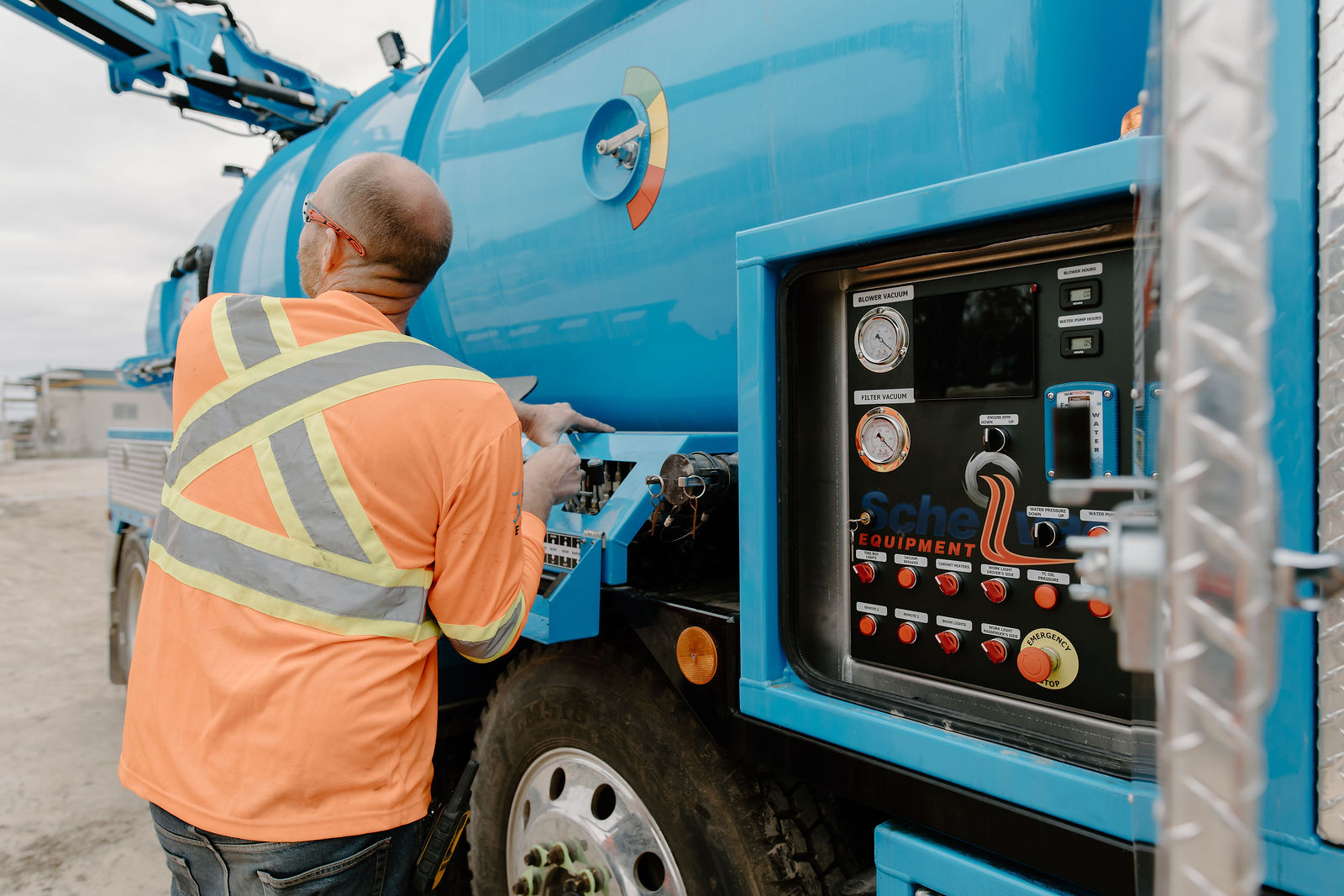 An OE operator at the hybrid hydrovac truck's control panel